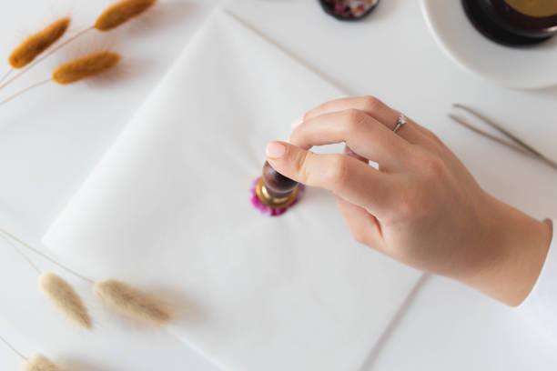 istock Handmade card with sealing wax in the process 1307055260