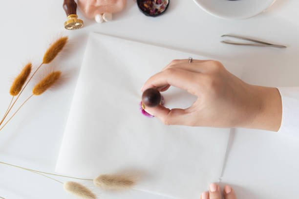 istock Handmade card with sealing wax in the process 1307055265