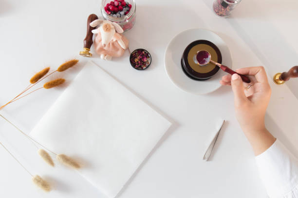 istock Handmade card with sealing wax in the process 1307055273