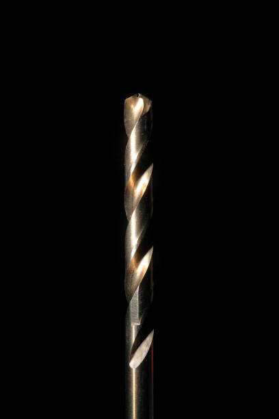istock Closeup of a cobalt steel drill bit with black background 1307055351
