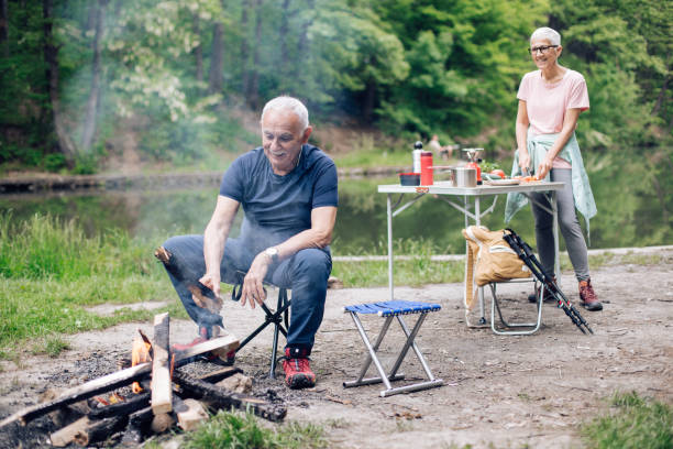 istock Senior campers enjoying on their camping adventure 1307057849