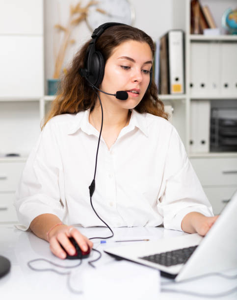 istock Young positive woman customer support phone operator 1307058294