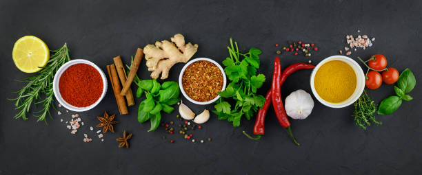istock Colorful various herbs and spices for cooking on dark background. 1307058307