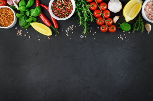 istock Colorful various herbs and spices for cooking on dark background, copy space, mock up, banner 1307058764