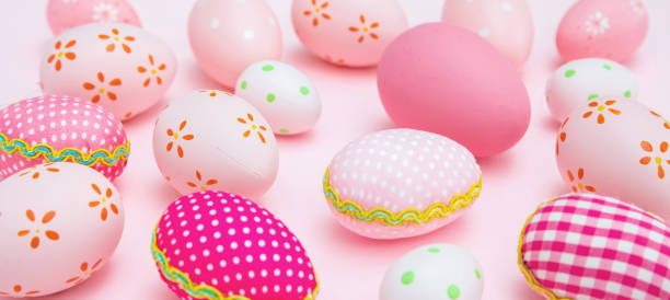istock Happy Easter. Pink pastel color eggs variety on pink background 1307059648