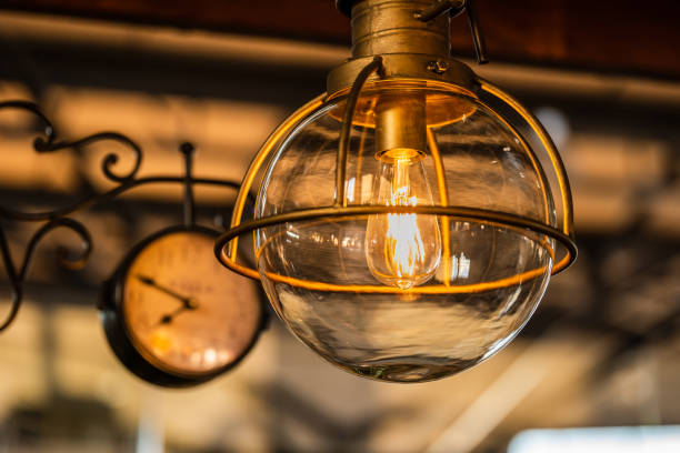 istock old wooden pole light and clock at night in an historic train station 1307062064