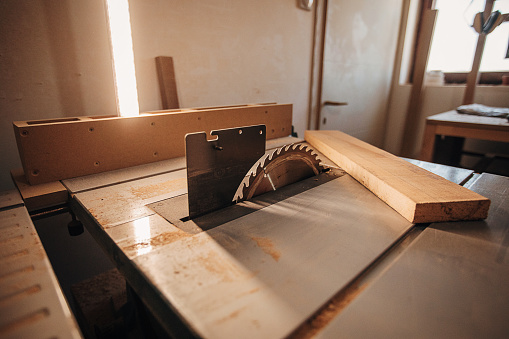 Circular saw in carpentry workshop. No people.