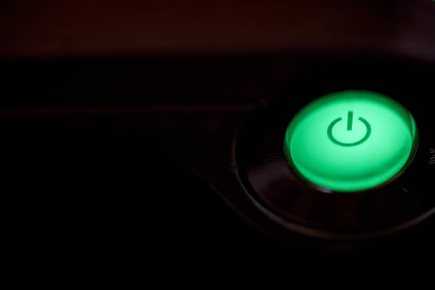 Cdznzofzcz green light button with sign turning on the computer. High quality photo