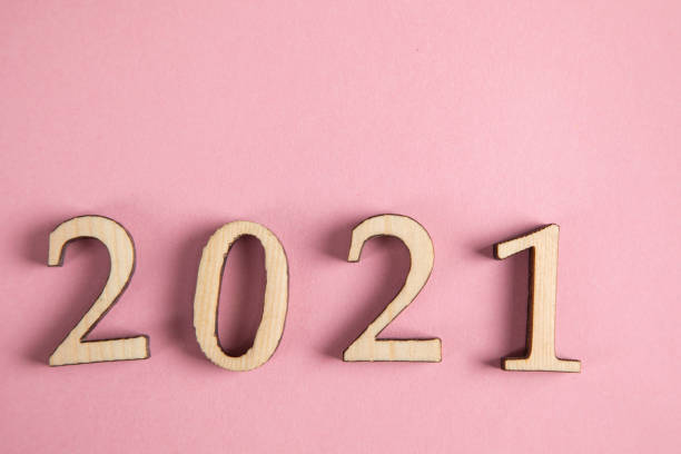 istock wooden 2021 text on pink background 1307064209
