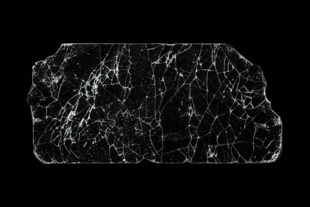 istock Broken glass piece isolated on black background. 1307065323