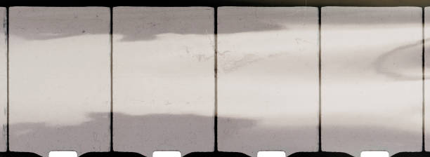 empty or blank 8mm film frame with black border and dust.