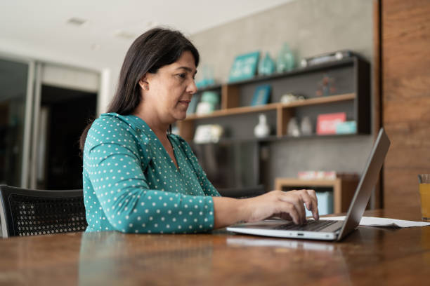 istock Mature woman working at home 1307065880