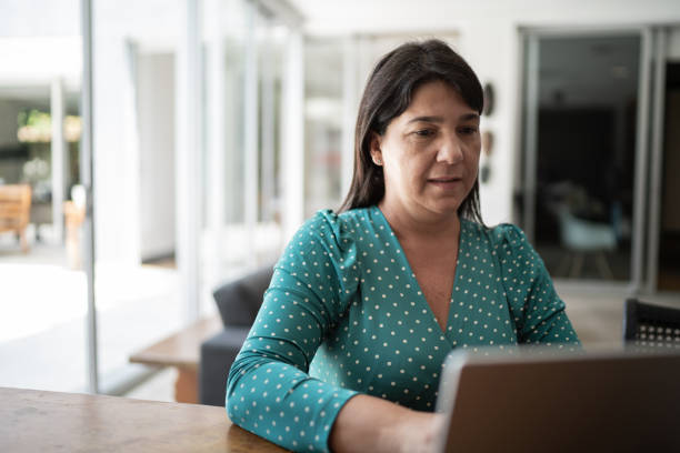 istock Mature woman working at home 1307065883
