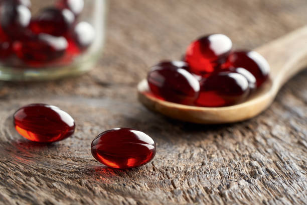 istock Krill oil capsules on a table 1307065899