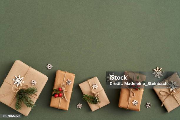 Christmas Presents Wrapped In Ecological Recycled Paper With Wooden Decoration And Wintergreen Zerowaste Concept Stock Photo - Download Image Now