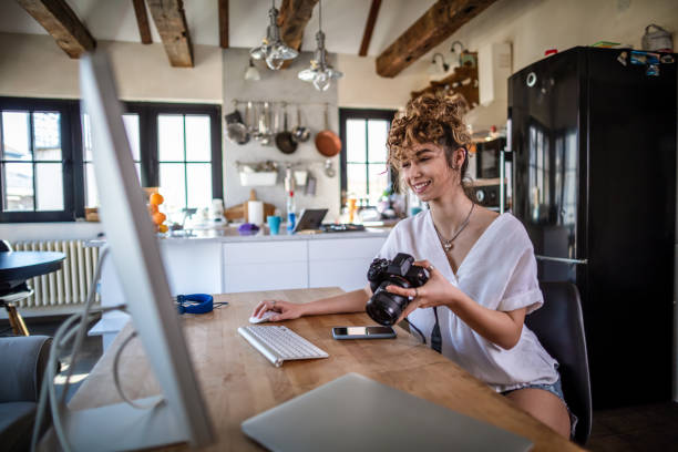 istock Young photographer working in her home office 1307066062
