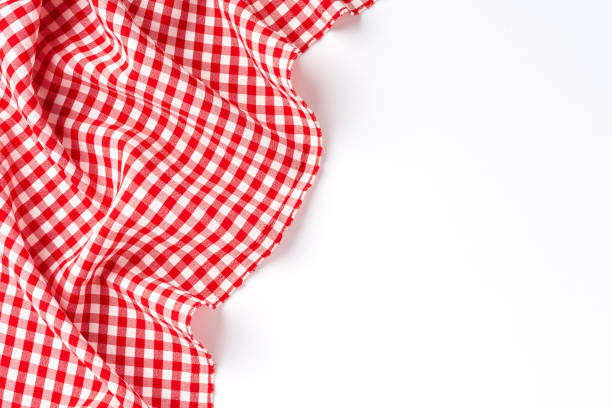 istock Overhead shot of red checkered table cloth with copyspace 1307066935
