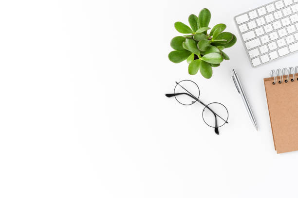 istock Elegant workspace with business accessories isolated on white background with copyspace. Office desktop 1307068303