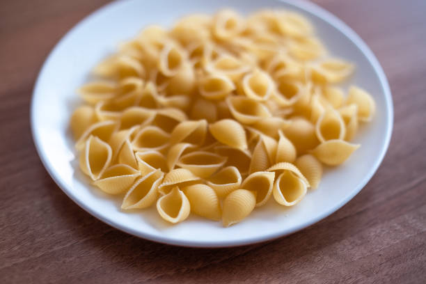 istock Plate of dried conchiglie pasta 1307068926