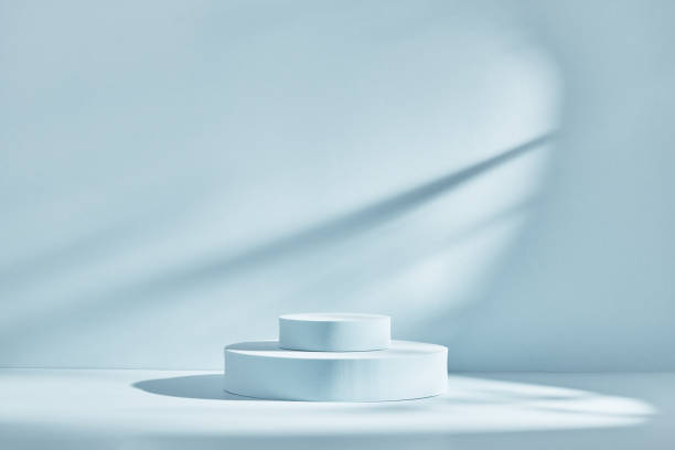 istock Blue background for product presentation with shadows and light. Empty round podiums. Mockup. 1307070153