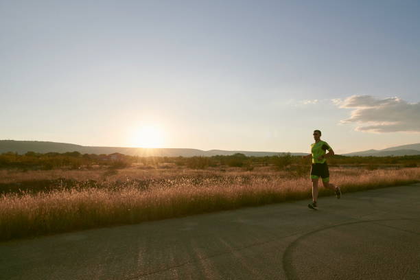 istock triathlon athlete running on morning trainig 1307070703