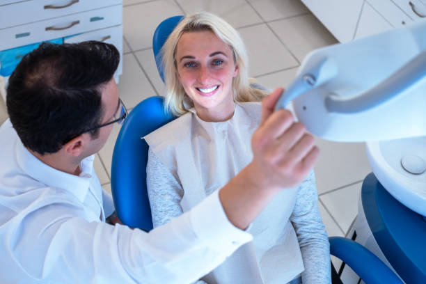 istock Dentist And Patient In Dentist Office 1307072263