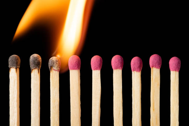 istock Line of matches igniting one by one 1307073789