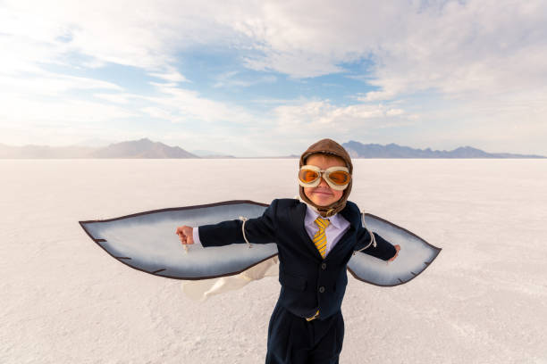 istock Young Business Boy Imagines Flying 1307077759