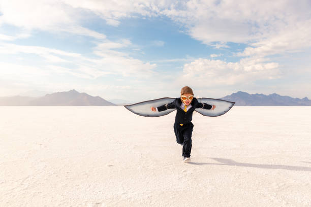 istock Young Business Boy Imagines Flying 1307077760