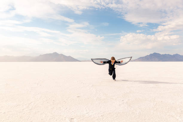istock Young Business Boy Imagines Flying 1307077880