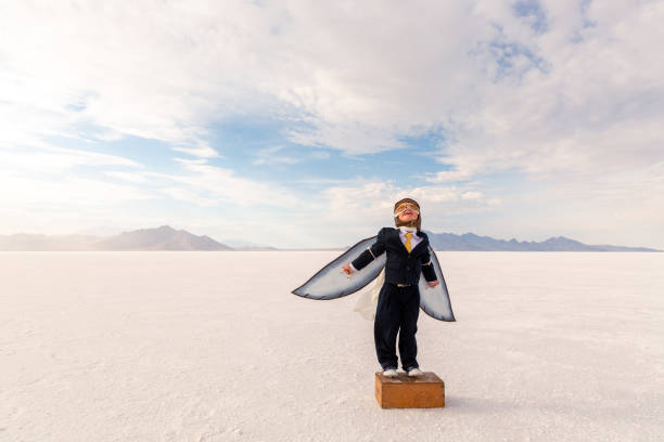 istock Young Business Boy Imagines Flying 1307077881