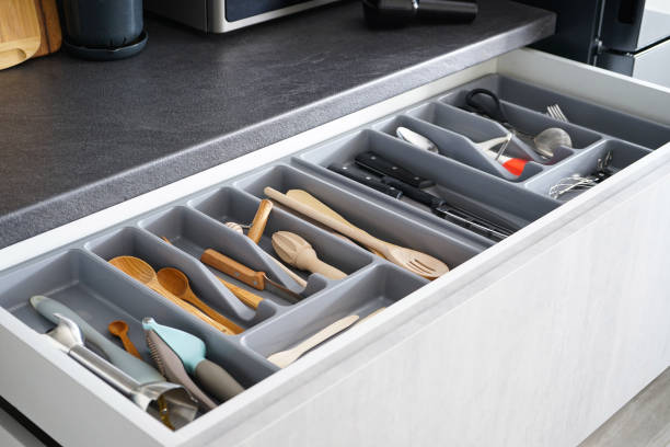 istock Set of clean kitchen utensils in drawer. 1307078542