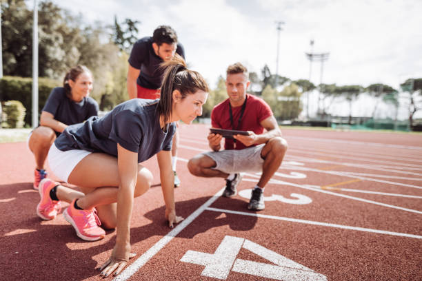 istock coach with runner on the track 1307078845