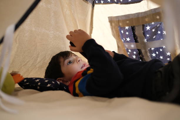istock Happy boy playing at home in a tent 1307079531