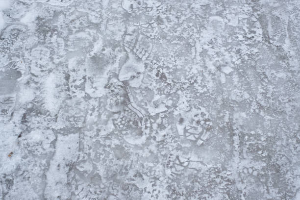istock Icy street and sidewalk. Dangerous traffic 1307080028