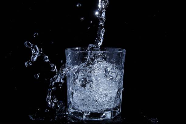 istock pouring water into the glass 1307080045