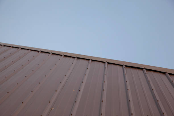 istock a metal roof against a blue sky 1307080138