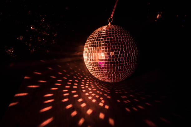 istock Colorful disco mirror ball lights night club background. Party lights disco ball. Selective focus 1307082995