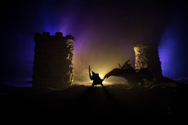 istock Battle between dragon and heroic soldiers. Creative table decoration. Selective focus 1307083058