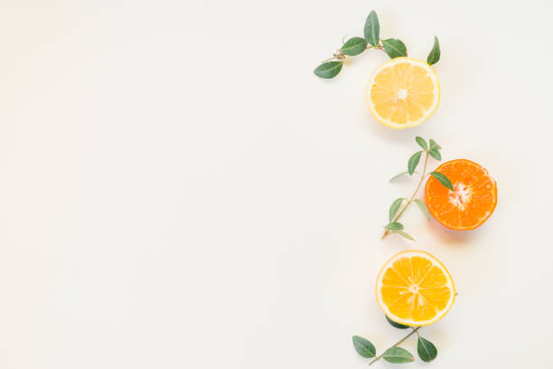 istock Fruit background. Colorful fresh fruits on white table. Orange,  lime, lemon, grapefruit. Flat lay, top view, copy space 1307085333