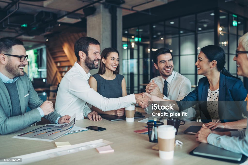 Handshake for the successful partnership Group of business persons handshake in the office Recruitment Stock Photo