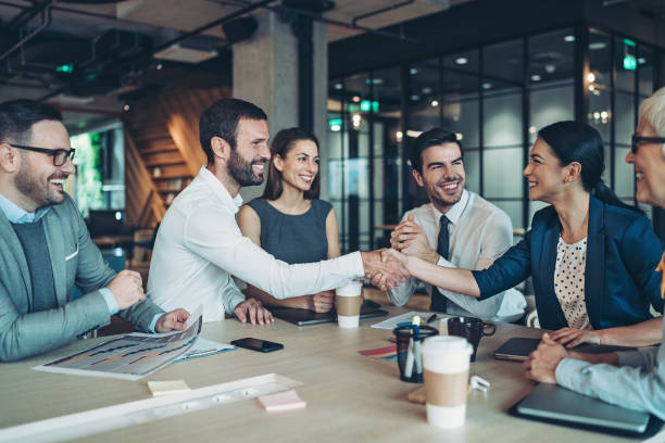 Handshake for the successful partnership Group of business persons handshake in the office business relationship photos stock pictures, royalty-free photos & images