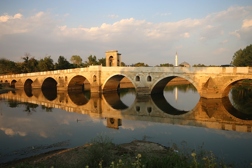 Edirne, Turkey-August 15, 2015: Historic Meric Bridge Over the Meric River. It is a bridge from the Ottoman Empire period. It was built in 1847 during the reign of Sultan Abdulmecit. The river is dry due to the drought.
