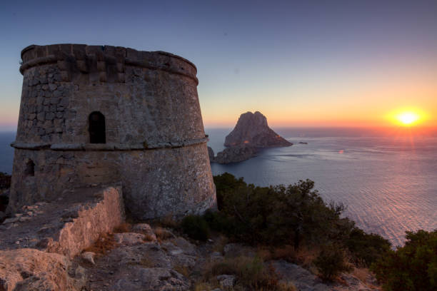 Sunset from Savinar tower with views of Es Vedra in Ibiza (Spain) stock photo