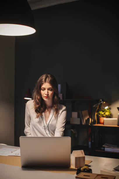 istock Young Freelance Businesswoman Using a Laptop at Work 1307091837