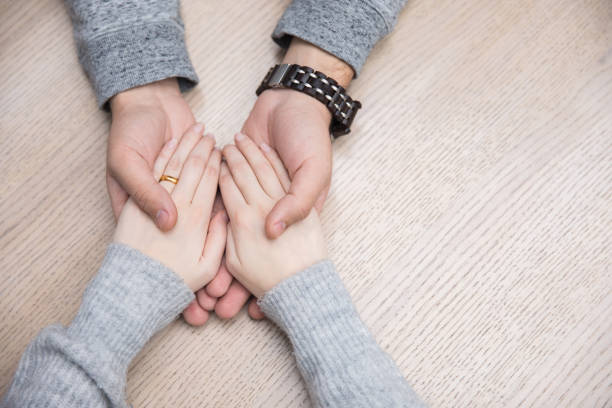 istock woman and man hand in hand 1307092520