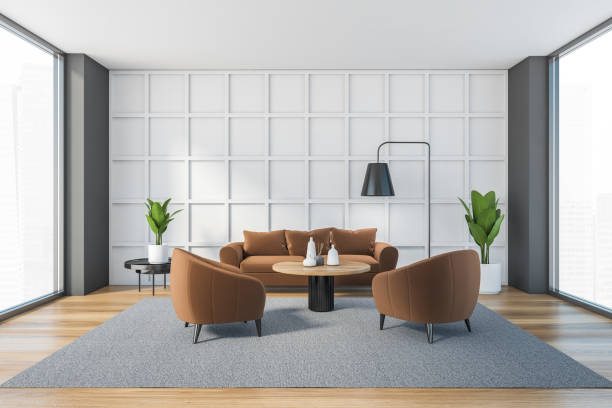 istock White and brown living room with sofa and armchairs on carpet 1307093754