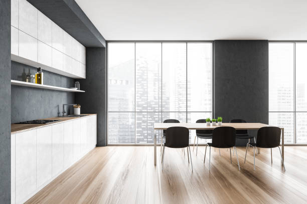 istock White and grey minimalist kitchen with chairs and table near window 1307093916
