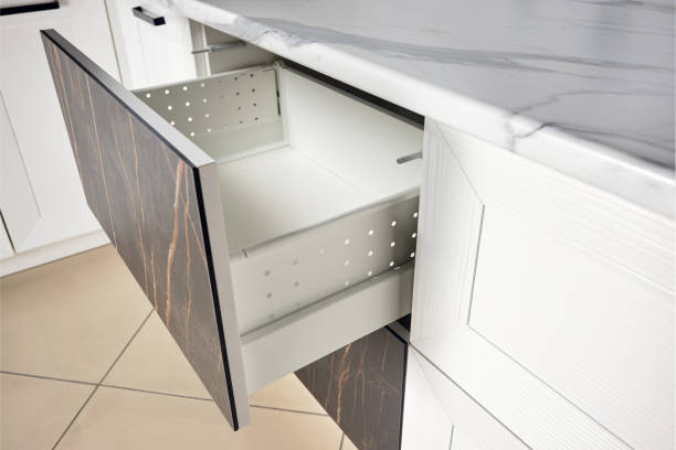 istock Kitchen Cabinet Door Drawer side view with Soft Quiet Closer Damper Buffers Cushion, solution to slow down closing action of cupboard, storage cabinet and drawer slamming reduce close noise protect. 1307094594
