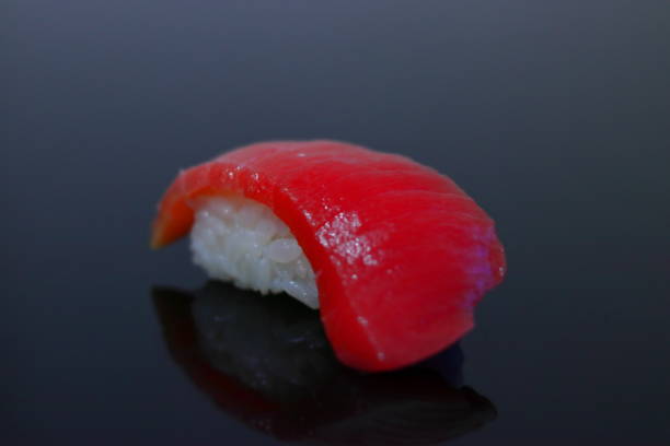 istock 1 piece of tuna sushi 1307094791